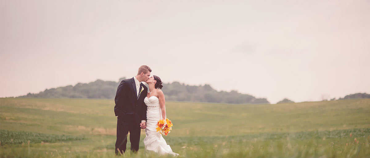 Newly wed couple at a field